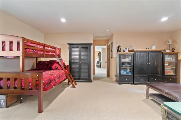 a bedroom with a bed and a cabinets