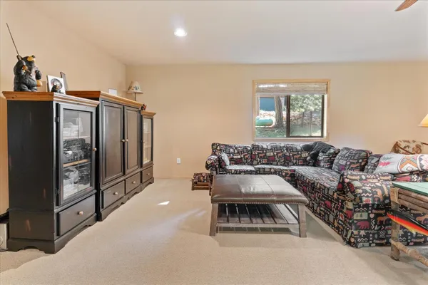 a living room with furniture gym equipment and a flat screen tv