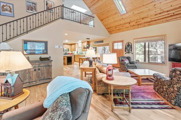 a living room with furniture a table and chairs