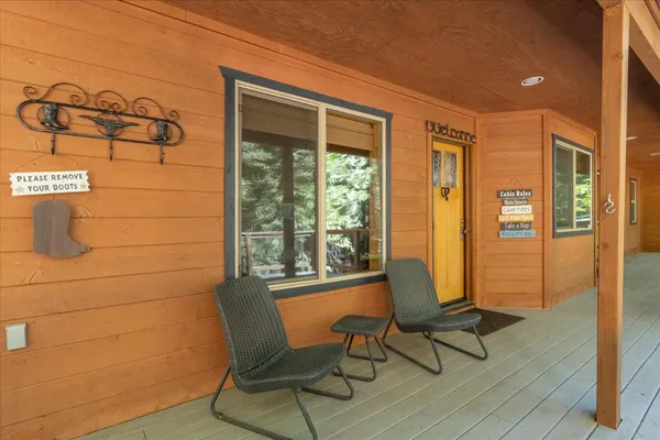 a view of a room with furniture and windows