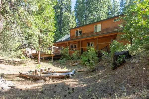 a backyard of a house with outdoor seating