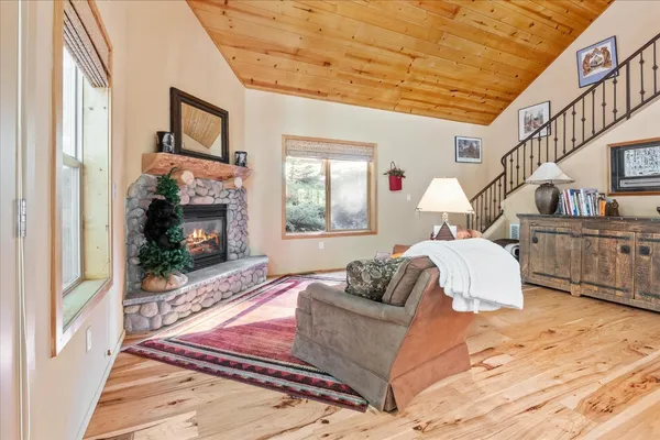 a bedroom with furniture and a fireplace