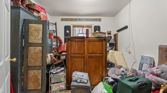 a bed room with furniture and a window