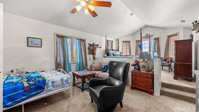 a bedroom with furniture and a chandelier
