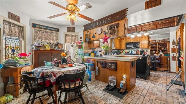 a view of a dining room with furniture and chandelier