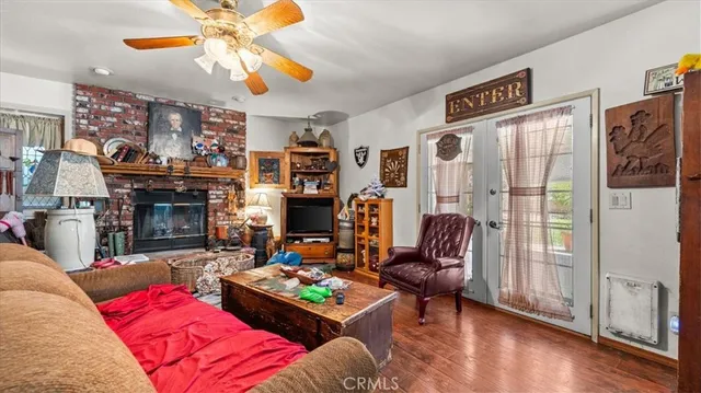 a living room with furniture fireplace and flat screen tv