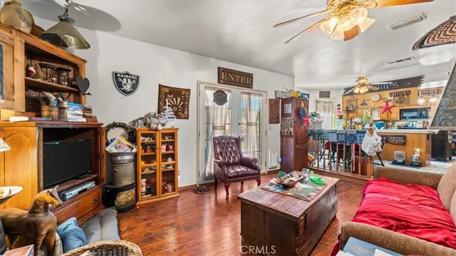 a living room with lots of furniture and a flat screen tv