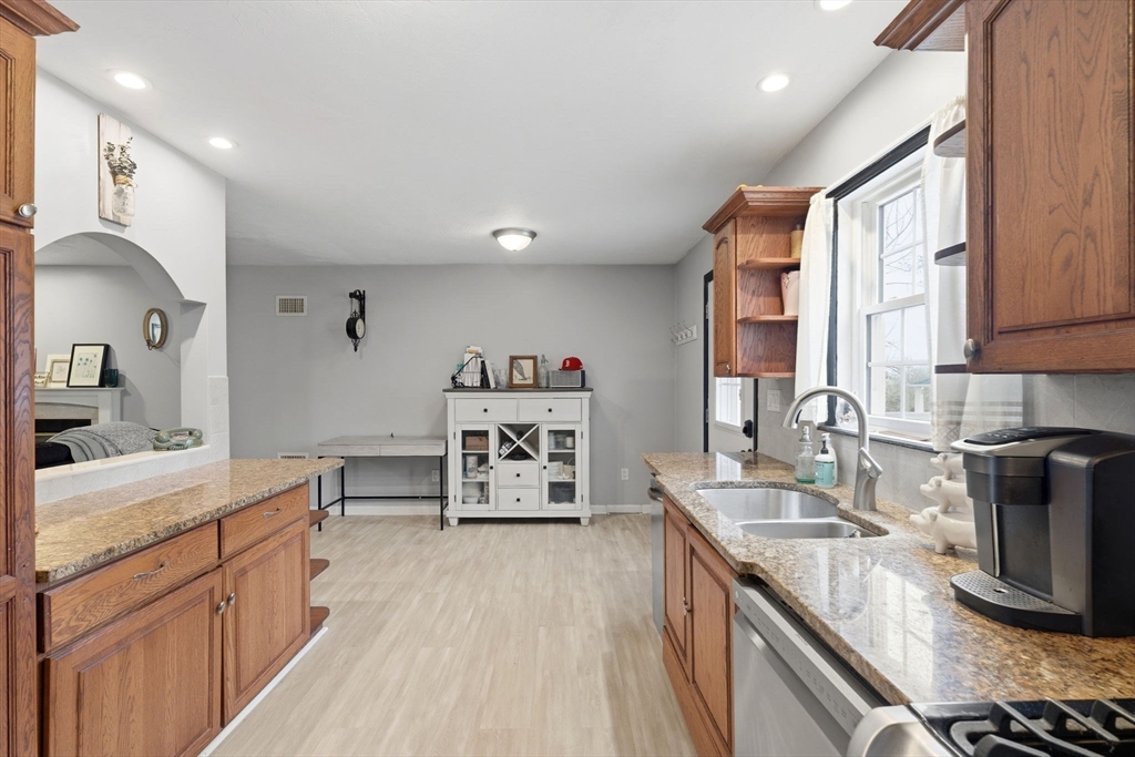 240 Horizon Way Fall River, MA 02720 - Photo 22 of 41 a kitchen with stainless steel appliances granite countertop a sink stove and refrigerator