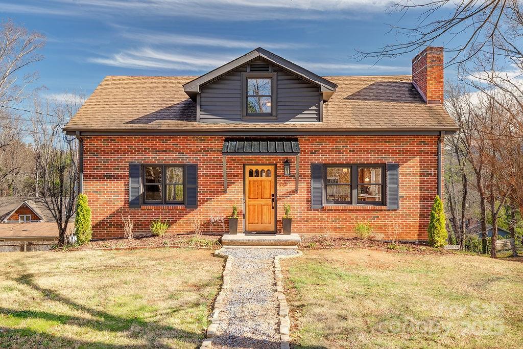 55 Cisco Road Asheville, NC 28805 - Photo 1 of 38 a view of a house with snow on the road