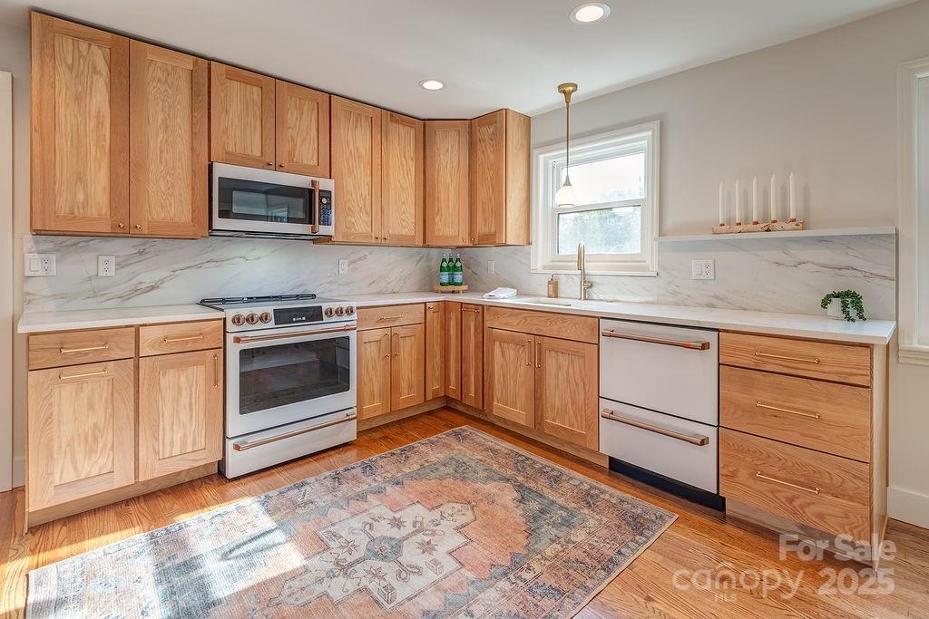 55 Cisco Road Asheville, NC 28805 - Photo 12 of 38 a kitchen with appliances cabinets and a sink