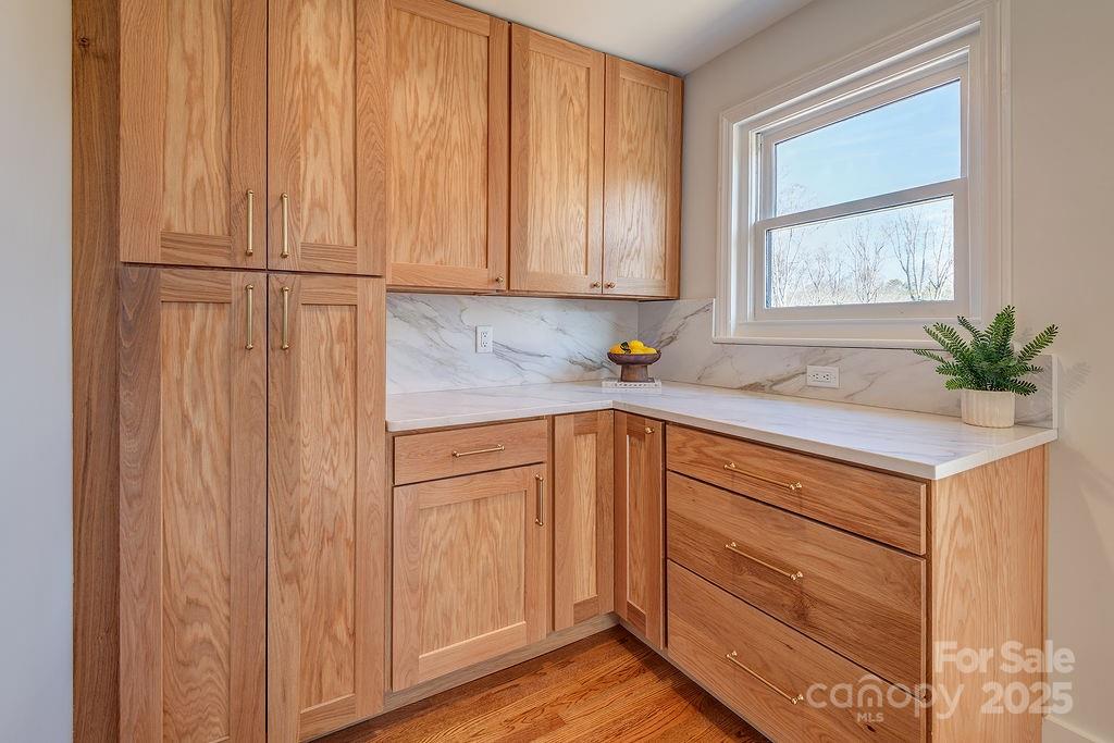 55 Cisco Road Asheville, NC 28805 - Photo 15 of 38 a kitchen with granite countertop cabinets stainless steel appliances and a window