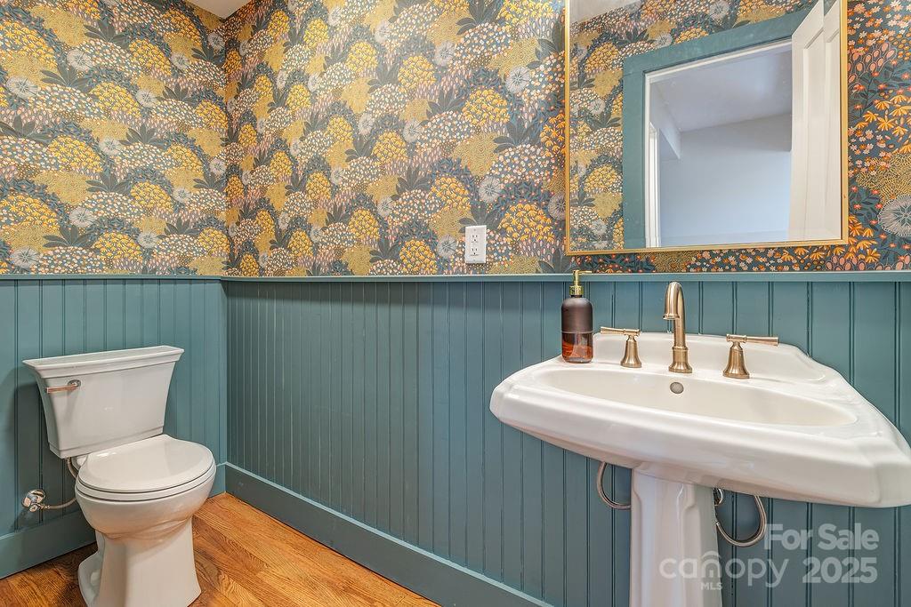 55 Cisco Road Asheville, NC 28805 - Photo 16 of 38 a bathroom with a sink a toilet and mirror