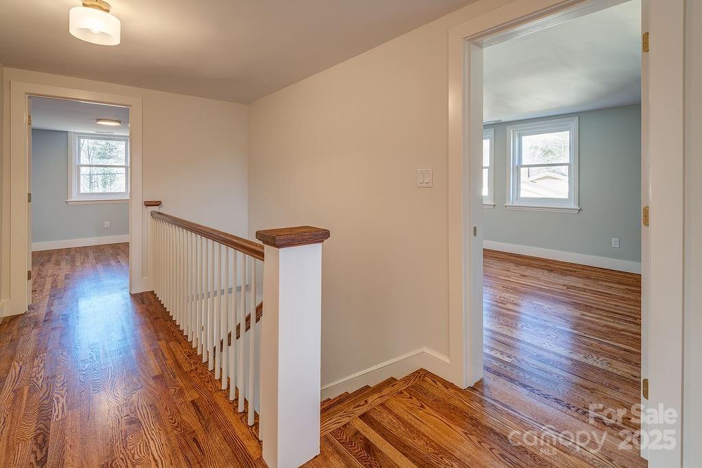 55 Cisco Road Asheville, NC 28805 - Photo 21 of 38 a view of a hallway with wooden floor and stairs