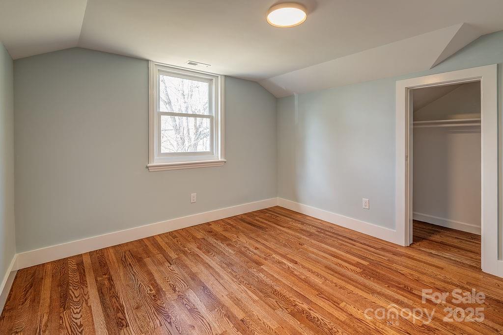 55 Cisco Road Asheville, NC 28805 - Photo 27 of 38 a view of an empty room with wooden floor and a window