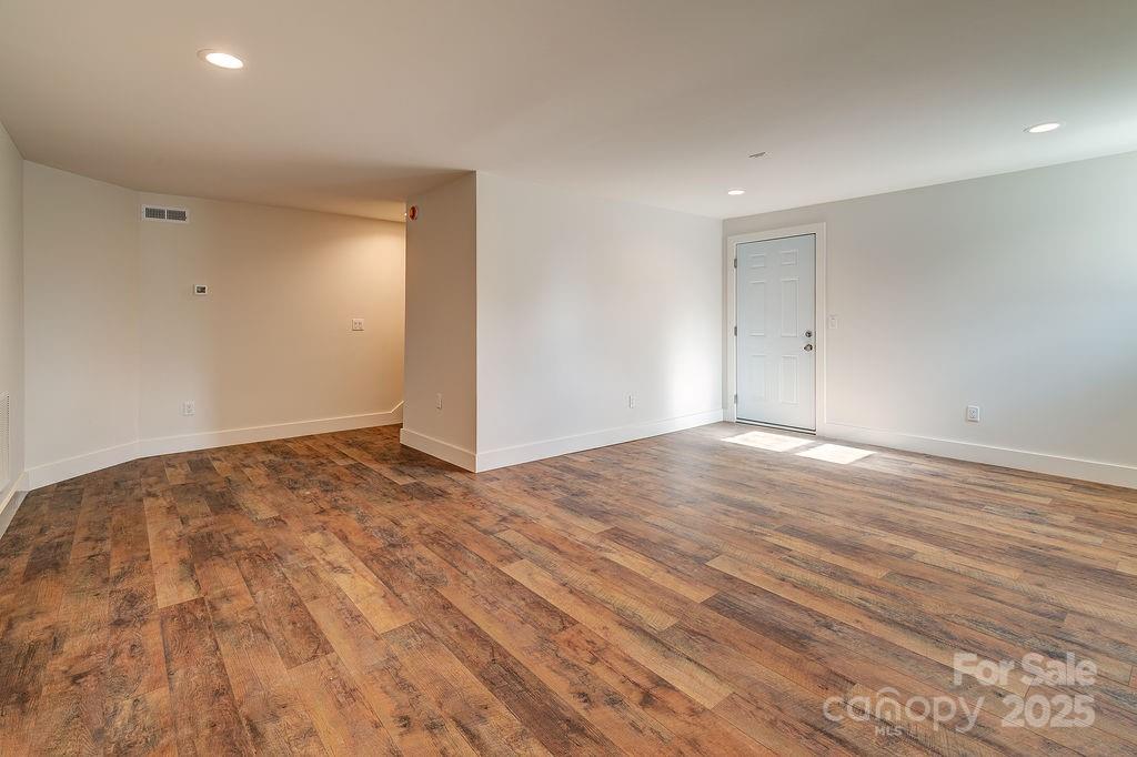 55 Cisco Road Asheville, NC 28805 - Photo 30 of 38 a view of empty room with wooden floor