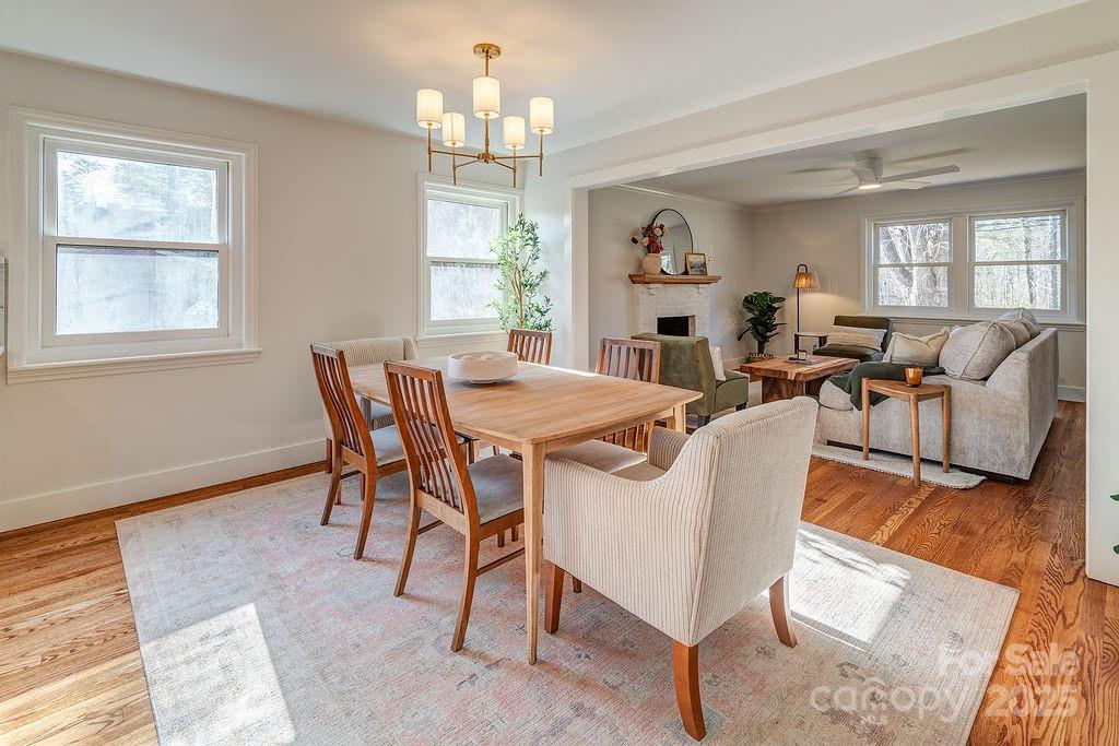 55 Cisco Road Asheville, NC 28805 - Photo 10 of 38 a view of a dining room with furniture window and wooden floor