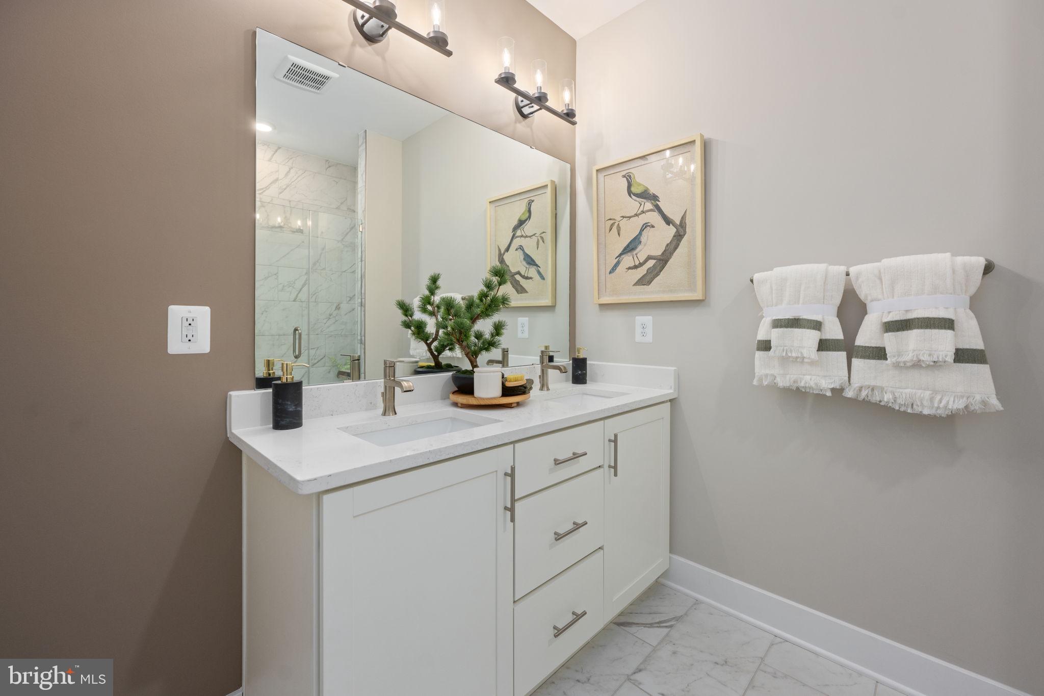 11367 Hypatia Loop Manassas, VA 20110 - Photo 35 of 80 a bathroom with a sink and a mirror