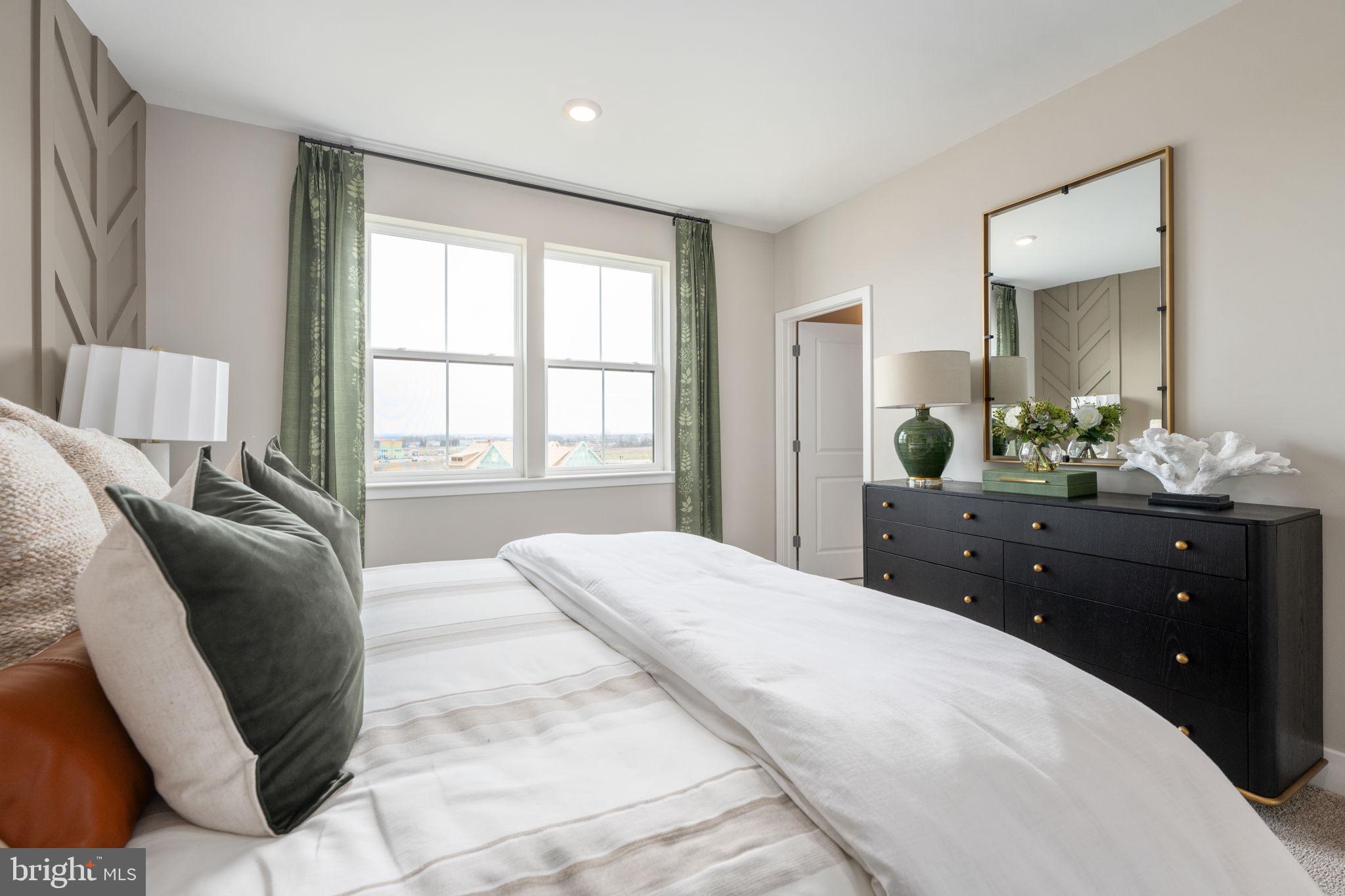 11367 Hypatia Loop Manassas, VA 20110 - Photo 37 of 80 a bedroom with a bed and window with large mirror