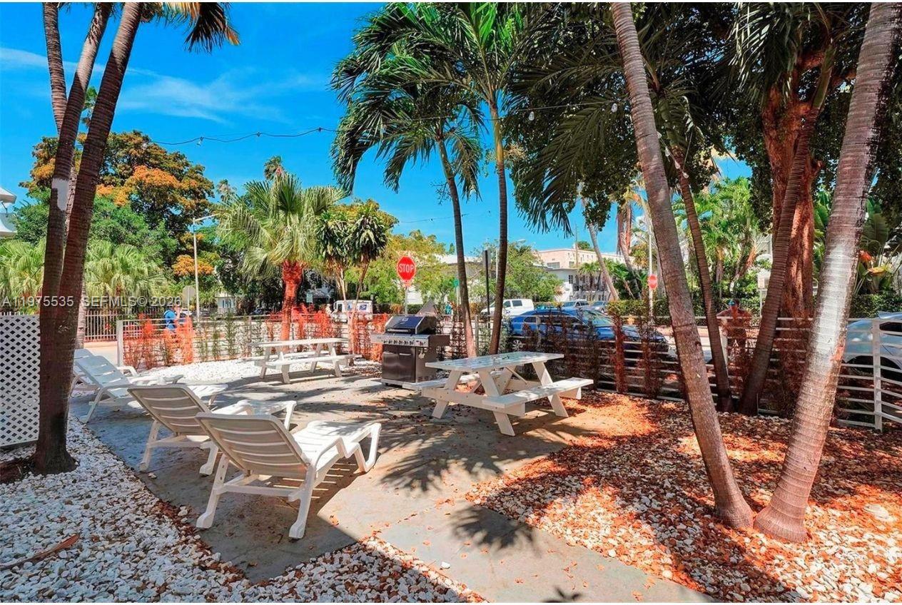 1000 7th Street Miami Beach, FL 33139 - Photo 21 of 36 a view of swimming pool with a patio and outdoor seating