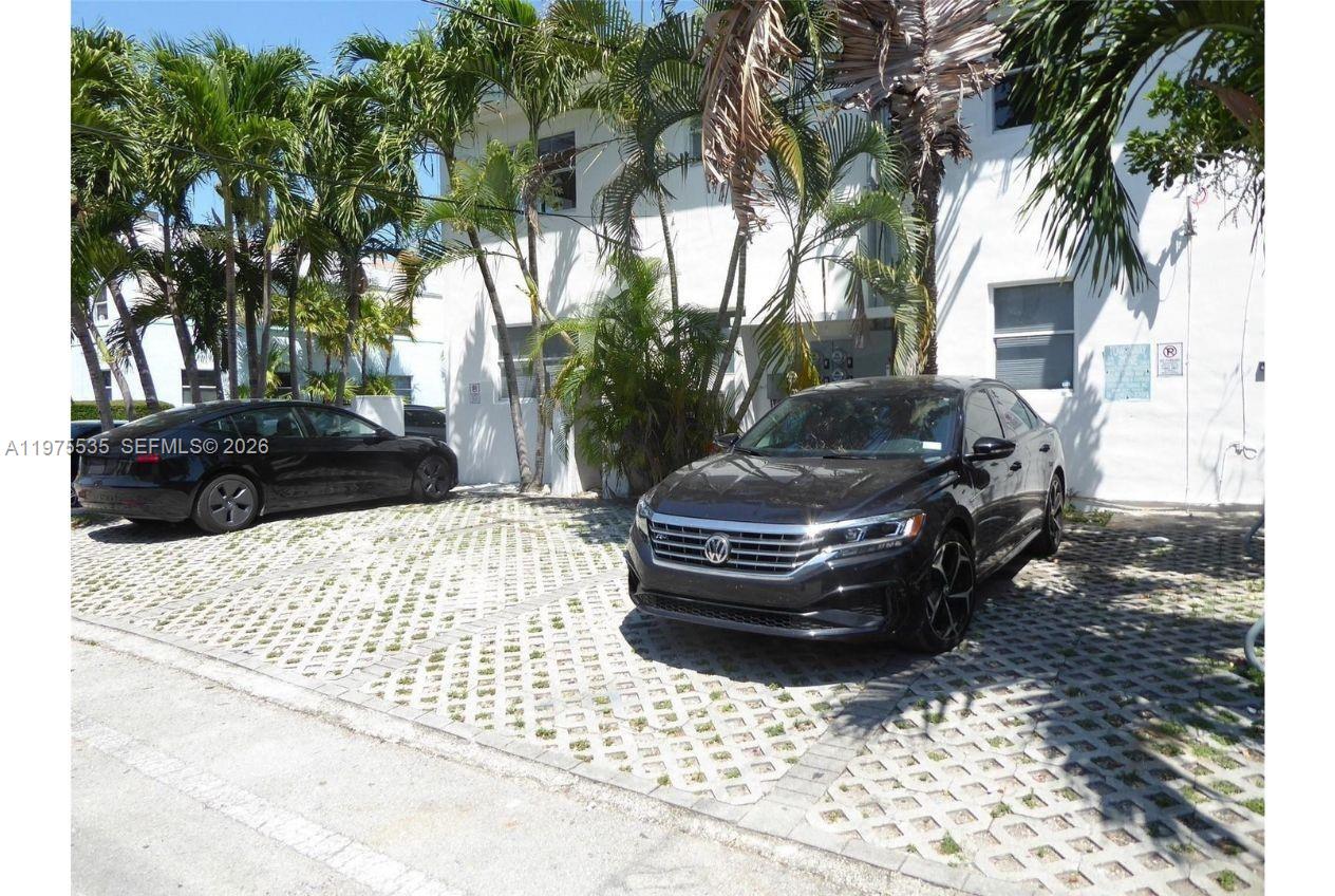 1000 7th Street Miami Beach, FL 33139 - Photo 30 of 36 a view of house with backyard and trees