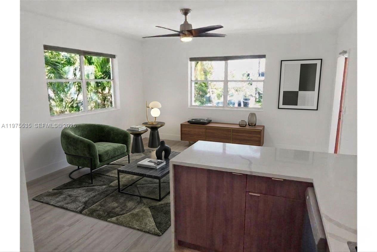 1000 7th Street Miami Beach, FL 33139 - Photo 9 of 36 a living room with furniture and a large window