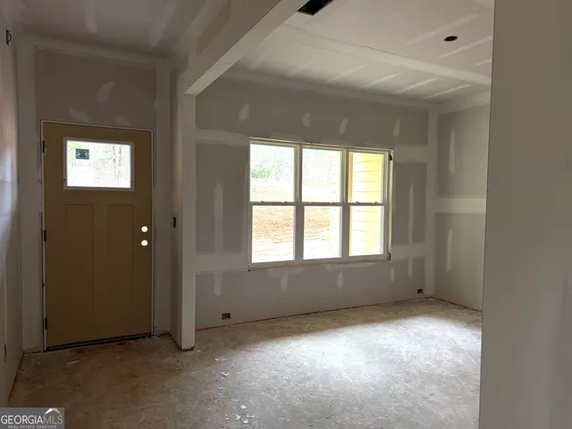 a living room with furniture and windows