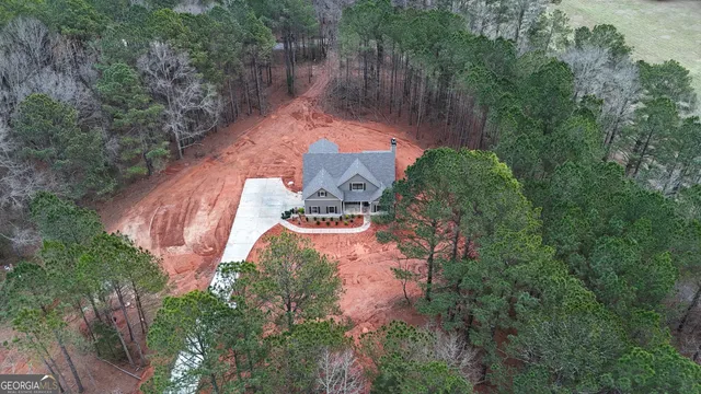 an aerial view of a house with outdoor space and street view