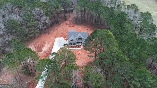 an aerial view of a house with outdoor space