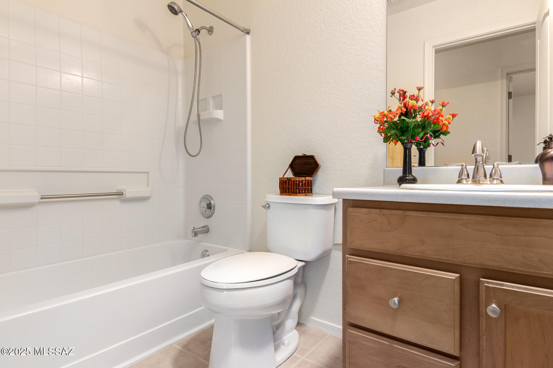 1516 North Old Ranch Road Tucson, AZ 85745 - Photo 21 of 27 a bathroom with a sink a toilet and shower