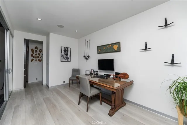 a workspace with furniture and wooden floor