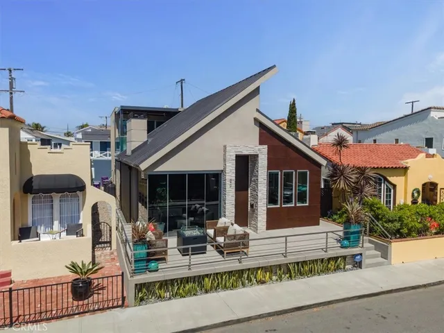 a front view of house with yard outdoor seating and green space