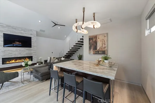a view of a dining room with furniture and a flat screen tv