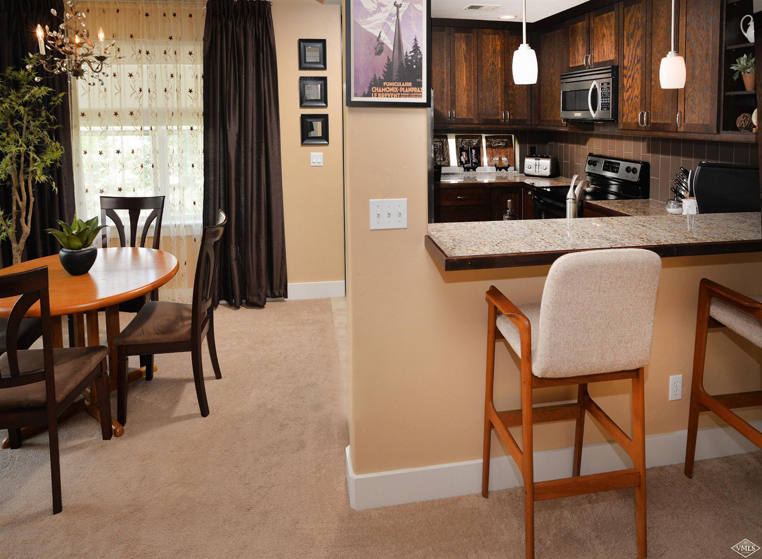 80 Freestone Road, Unit B201 Eagle, CO 81631 - Photo 6 of 15 a dining room with furniture and window