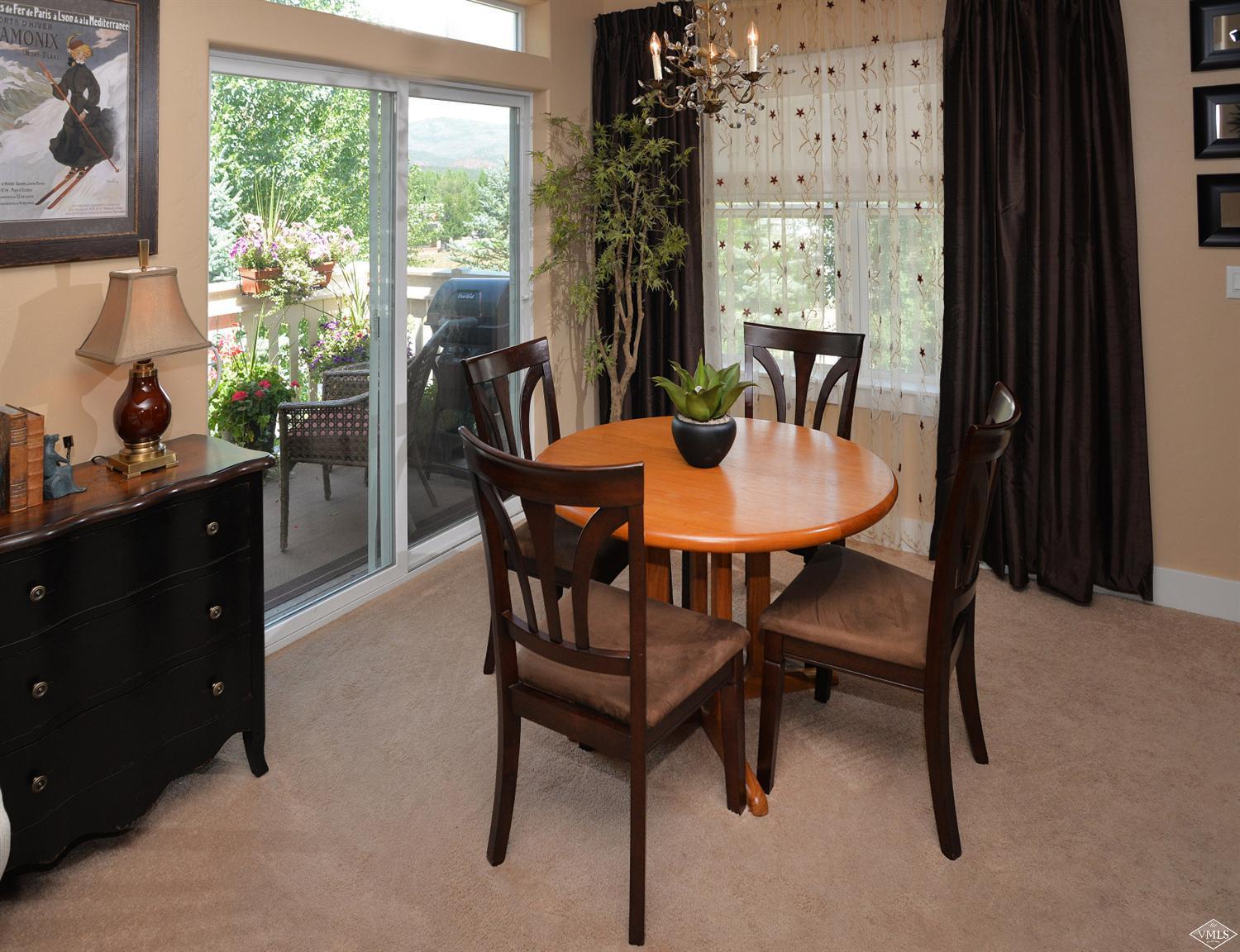 80 Freestone Road, Unit B201 Eagle, CO 81631 - Photo 9 of 15 a view of a dining room with furniture window and outside view