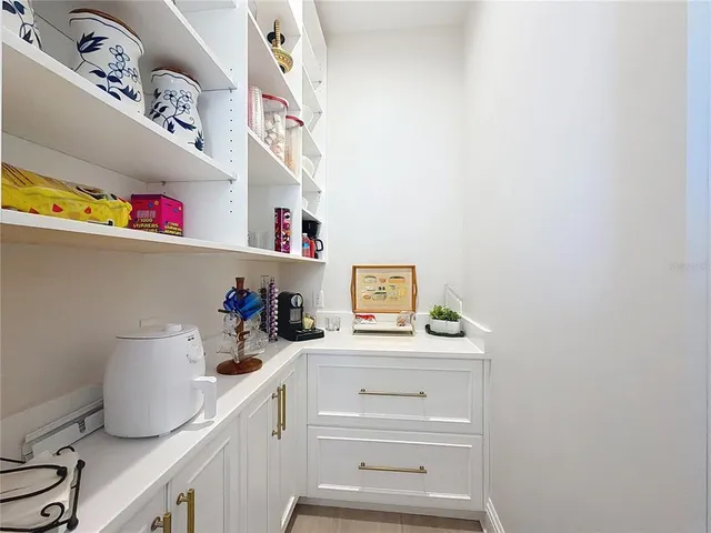 a kitchen with a cabinets and window