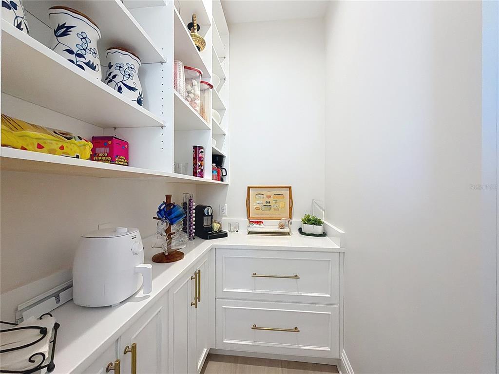 7394 Gathering Court Reunion, FL 34747 - Photo 13 of 44 a kitchen with a cabinets and window