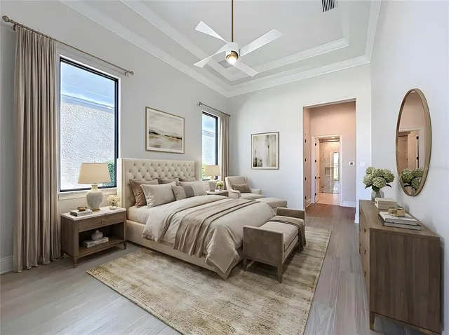 a bedroom with a bed a mirror and furniture