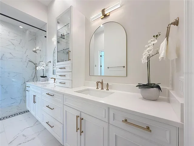 a bathroom with a double vanity sink mirror and