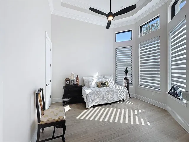 a bedroom with furniture and a window