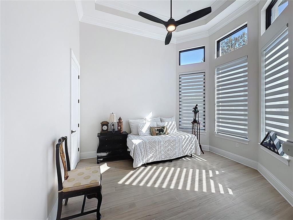 7394 Gathering Court Reunion, FL 34747 - Photo 21 of 44 a bedroom with furniture and a window