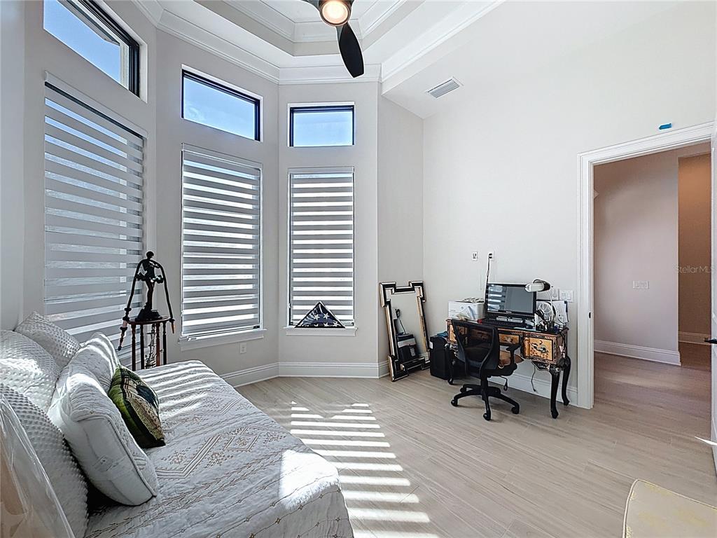 7394 Gathering Court Reunion, FL 34747 - Photo 22 of 44 a bedroom with furniture and a window