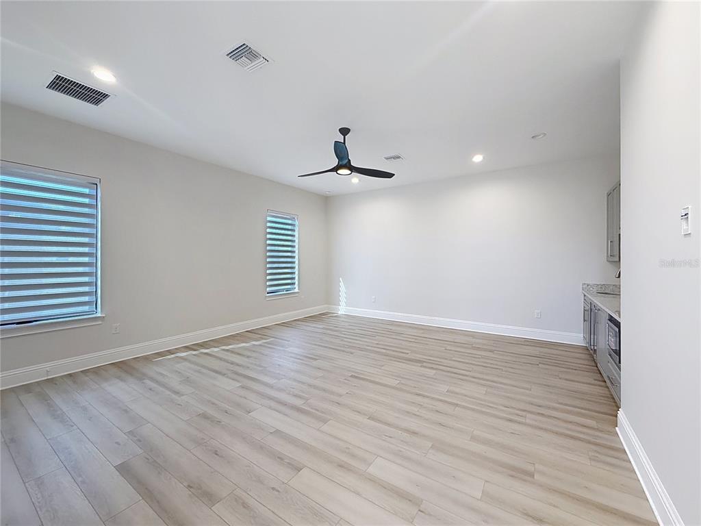 7394 Gathering Court Reunion, FL 34747 - Photo 26 of 44 wooden floor in an empty room with a window
