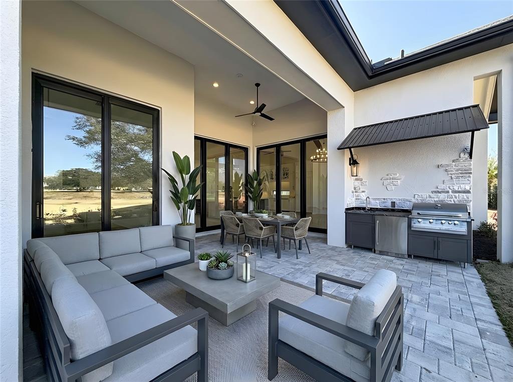 7394 Gathering Court Reunion, FL 34747 - Photo 30 of 44 a living room with furniture and large windows