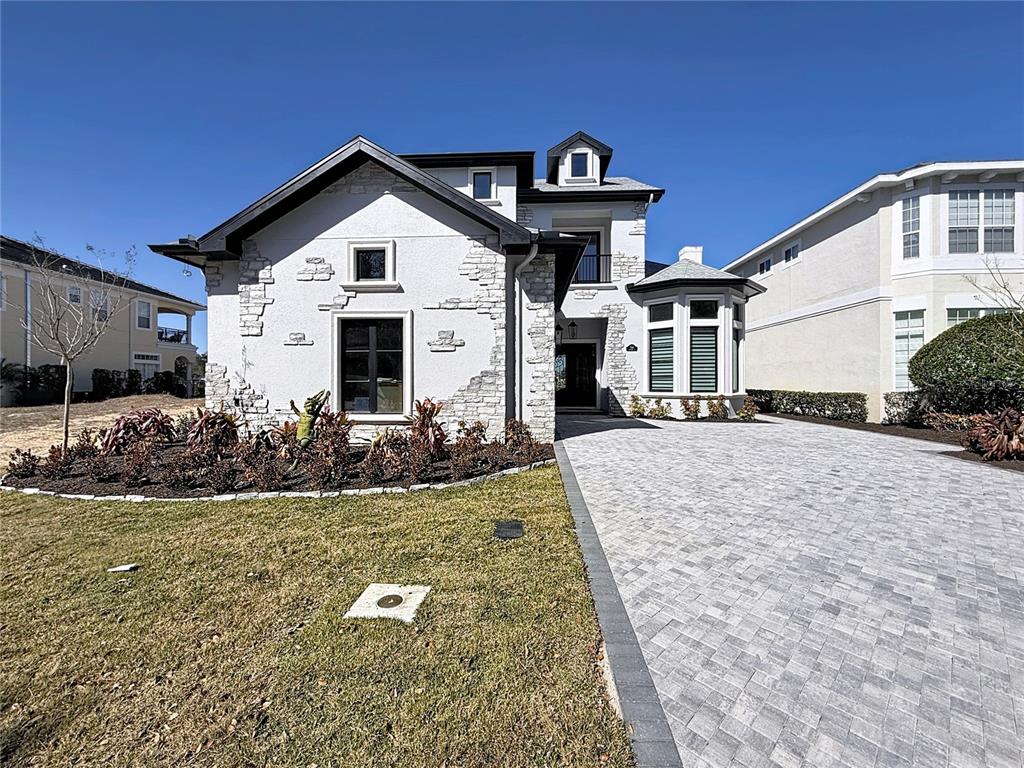 7394 Gathering Court Reunion, FL 34747 - Photo 3 of 44 a front view of a house with a yard