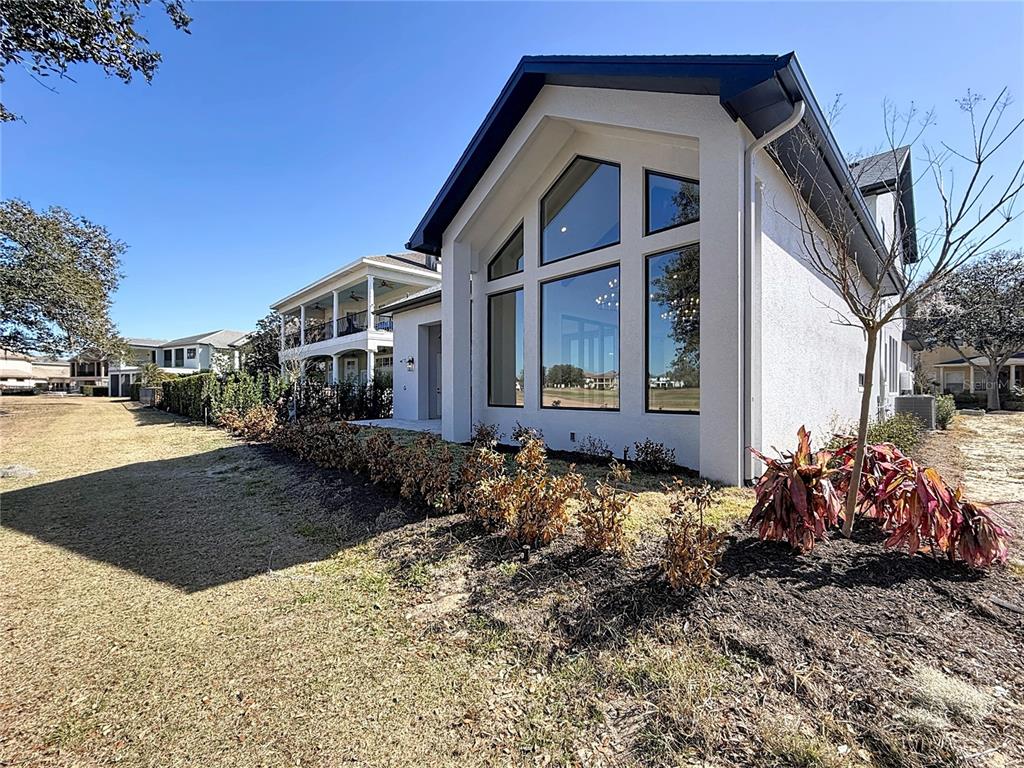 7394 Gathering Court Reunion, FL 34747 - Photo 32 of 44 a front view of a house with garden