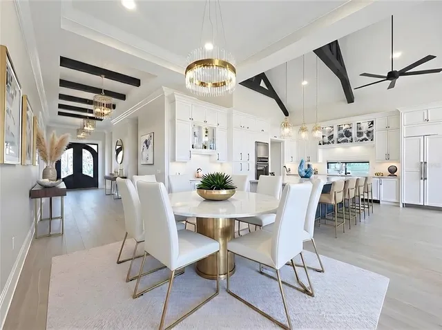 a dining room with furniture and wooden floor