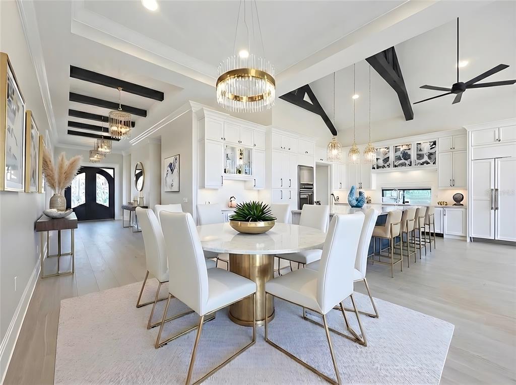 7394 Gathering Court Reunion, FL 34747 - Photo 6 of 44 a dining room with furniture and wooden floor