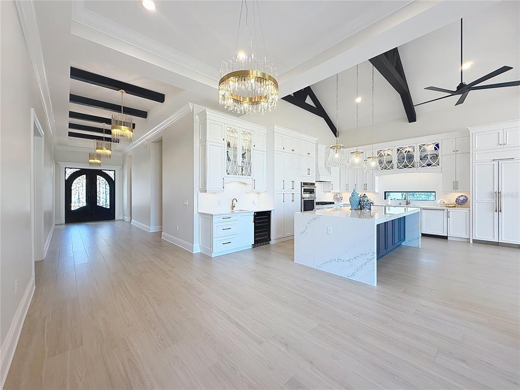 7394 Gathering Court Reunion, FL 34747 - Photo 7 of 44 a view of a kitchen with furniture and wooden floor