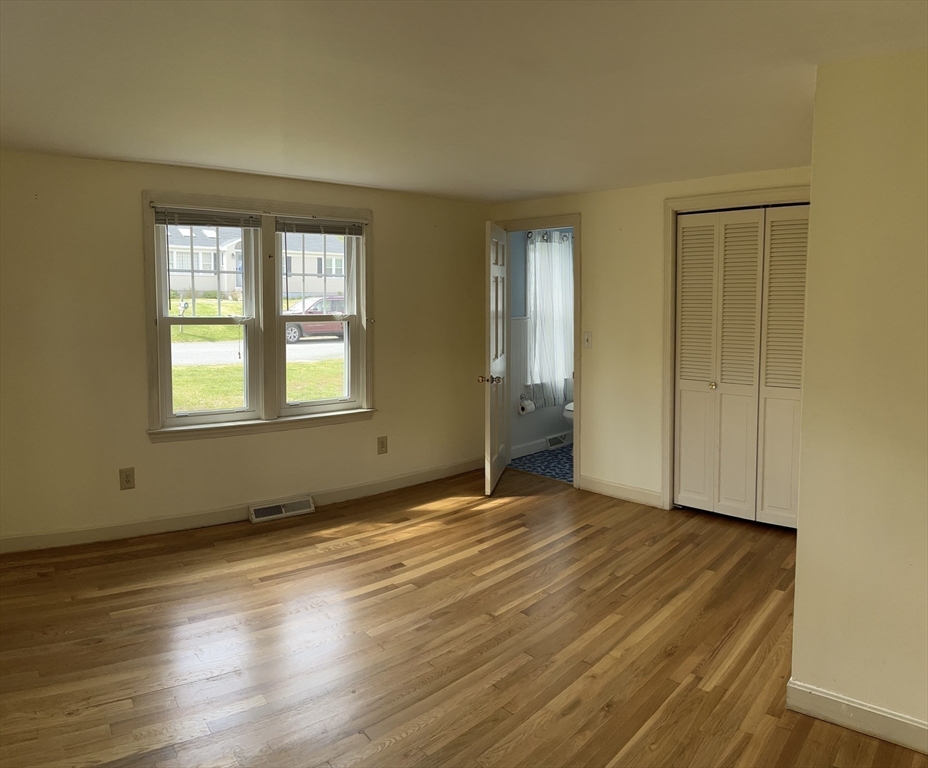 32 Westminster Road Centerville, MA 02632 - Photo 15 of 23 a view of an empty room with wooden floor and a window