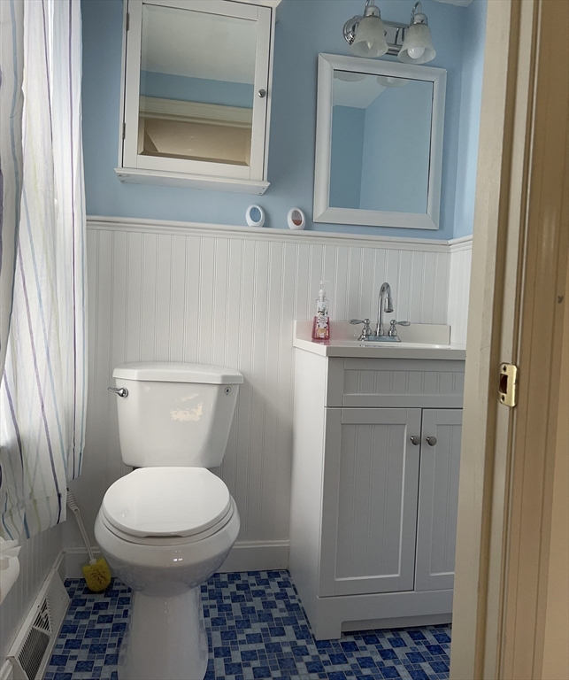 32 Westminster Road Centerville, MA 02632 - Photo 16 of 23 a bathroom with a toilet a sink and a window